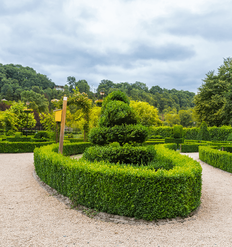 Formal topiary garden lining a gravel path